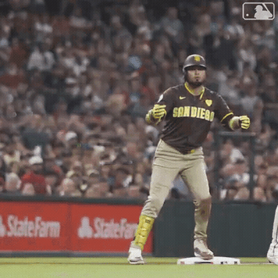 A Baseball Player In A San Diego Uniform Is Standing On The Base . GIF