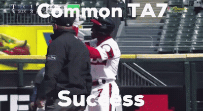 A Baseball Player Is Being Hugged By A Referee With The Words " Common Ta7 Success " Above Him GIF