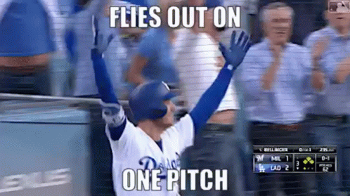 A Baseball Player Is Celebrating A Home Run With His Arms In The Air And A Caption That Says Flies Out On One Pitch . GIF