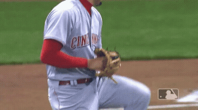A Baseball Player Is Getting Ready To Catch A Ball On A Baseball Field GIF