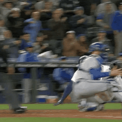 A Baseball Player Is Getting Ready To Catch A Ball While A Catcher Watches . GIF