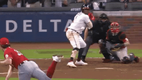 A Baseball Player Is Getting Ready To Hit A Ball While A Catcher Tries To Catch The Ball . GIF