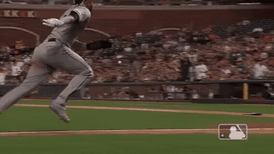 A Baseball Player Is Getting Ready To Throw A Ball While A Catcher Looks On . GIF
