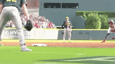 A Baseball Player Is Getting Ready To Throw A Ball While Another Player Watches . GIF