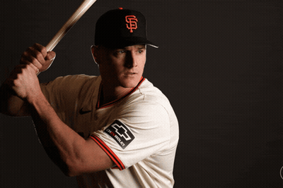 A Baseball Player Is Holding A Bat And The Name Matt Cayman Is Visible GIF