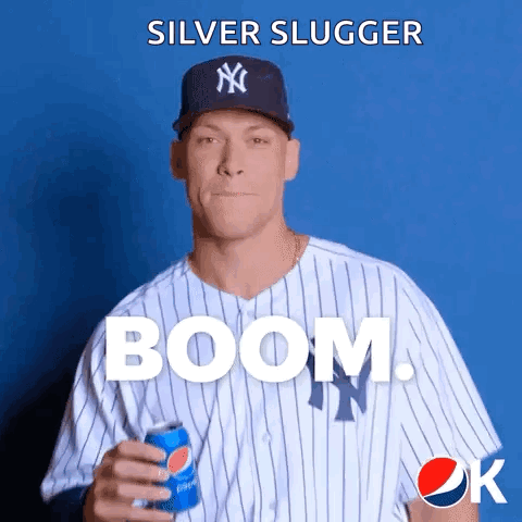 A Baseball Player Is Holding A Can Of Pepsi In His Hand GIF