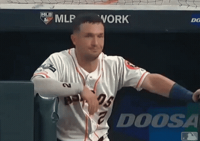 A Baseball Player Is Leaning Against A Wall With A Doosa Logo In The Background GIF