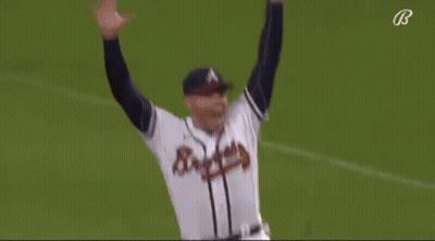A Baseball Player Is Running On The Field While Wearing A Braves Jersey . GIF