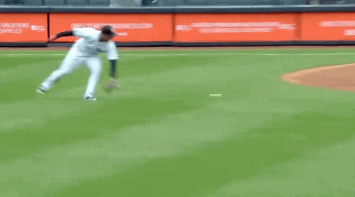 A Baseball Player Is Running On The Field With A Glove GIF