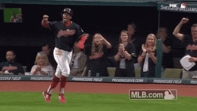 A Baseball Player Is Running On The Field With A Mlb.com Logo Behind Him GIF