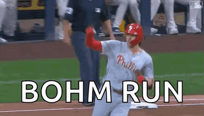 A Baseball Player Is Running Towards Home Plate With The Words Bohm Run Written On The Ground . GIF