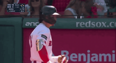 A Baseball Player Is Standing In Front Of A Neca Ad GIF
