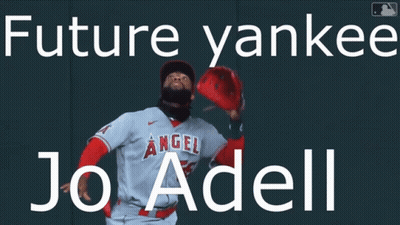 A Baseball Player Is Standing In Front Of A Wall That Says Future Yankees Jo Adell GIF