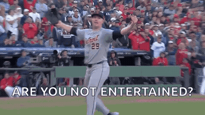 A Baseball Player Is Standing On A Baseball Field With His Arms Outstretched And The Words `` Are You Not Entertained ?  GIF