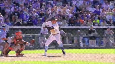 A Baseball Player Is Swinging A Bat At A Pitch While A Catcher Watches . GIF