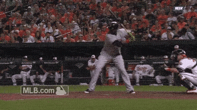 A Baseball Player Is Swinging His Bat At A Pitch While A Mlb.com Logo Is Visible In The Background GIF