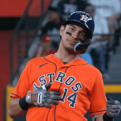A Baseball Player Is Wearing An Orange Jersey With The Number 14 On It . GIF