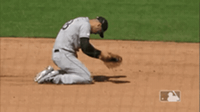 A Baseball Player Kneeling On The Field With A Mlb Logo In The Corner GIF