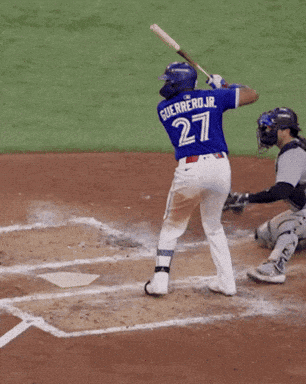 A Baseball Player Named Guerrero Jr. Is Swinging His Bat GIF