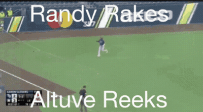 A Baseball Player Named Randy Rakes Runs To First Base GIF