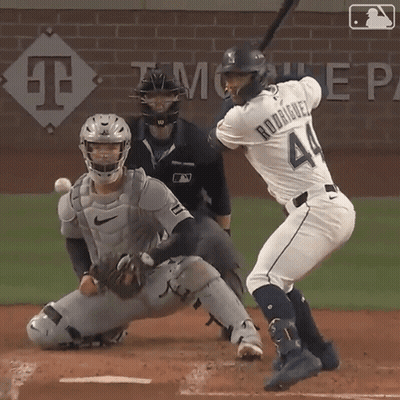 A Baseball Player Named Rodriguez Is Swinging At A Ball GIF