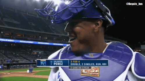 A Baseball Player Named Salvador Perez Is Wearing A Catcher 'S Chest Guard GIF