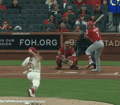 A Baseball Player Named Smith Is Swinging His Bat At A Pitch GIF
