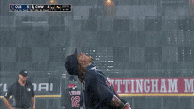 A Baseball Player Stands In Front Of A Sign That Says Ettingha GIF
