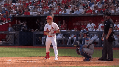 A Baseball Player Stands In Front Of A Sign That Says London Series On It GIF