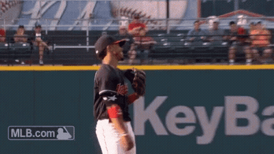 A Baseball Player Stands On A Field With A Key Bank Logo In The Background GIF