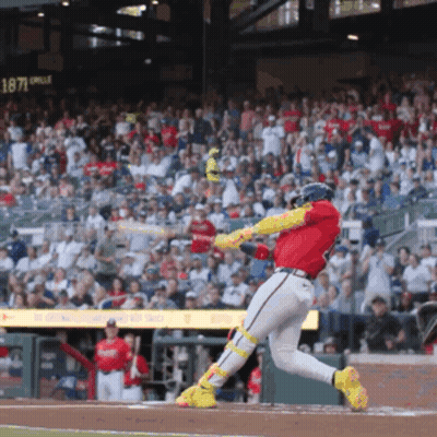A Baseball Player Swings A Bat At A Ball In Front Of A Scoreboard That Says 1871 On It GIF