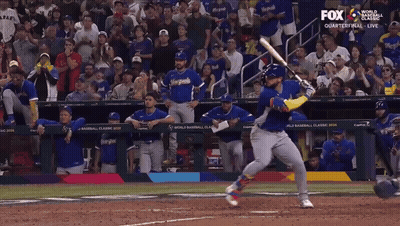 A Baseball Player Swings At A Pitch While Fox Broadcasts The Game GIF