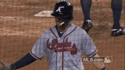 A Baseball Player Wearing A Atlanta Braves Jersey GIF