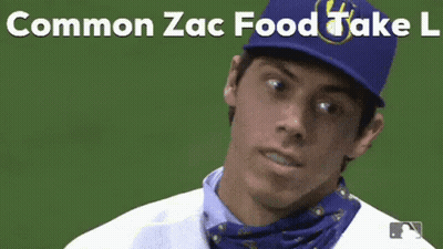 A Baseball Player Wearing A Bandana Around His Neck And A Blue Hat With The Words Common Zac Food Take L On It . GIF