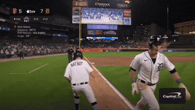 A Baseball Player Wearing A Bat Boy Jersey Is Running Towards The Base GIF