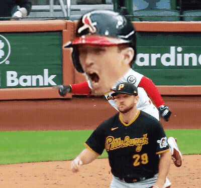 A Baseball Player Wearing A Black Jersey With The Number 29 GIF