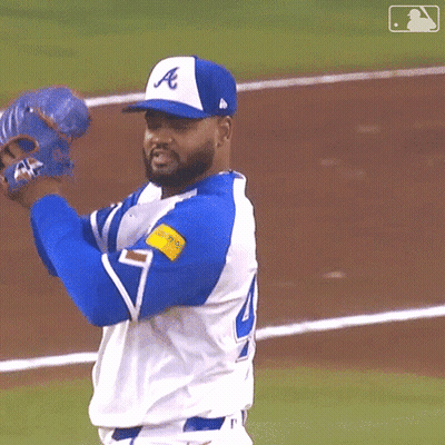 A Baseball Player Wearing A Blue And White Uniform With The Letter A On It GIF