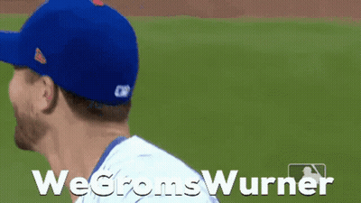 A Baseball Player Wearing A Blue Hat Is Smiling With The Words Wegromswurner Written Below Him GIF