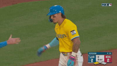 A Baseball Player Wearing A Blue Helmet And A Yellow Jersey With The Word Posto On It GIF