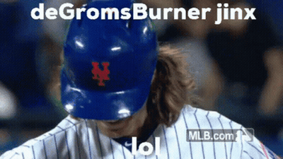 A Baseball Player Wearing A Blue Helmet With The Letter N On The Front GIF