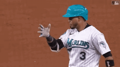 A Baseball Player Wearing A Blue Helmet With The Name Ari On The Back Of His Shirt GIF