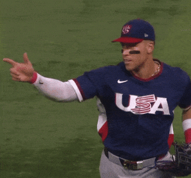 A Baseball Player Wearing A Blue Jersey That Says Usa On It GIF