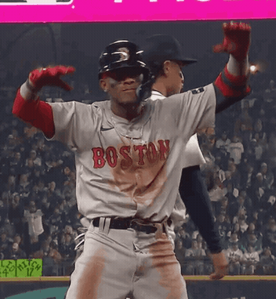 A Baseball Player Wearing A Boston Jersey Is Dancing GIF