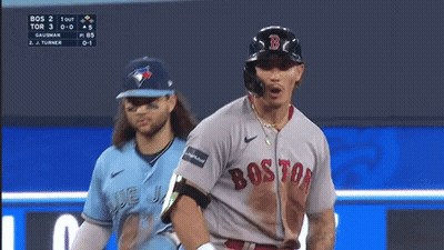 A Baseball Player Wearing A Boston Jersey Is Looking Down GIF