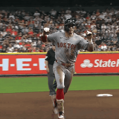 A Baseball Player Wearing A Boston Jersey Is Running Towards The Base GIF