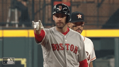 A Baseball Player Wearing A Boston Jersey Points At The Camera GIF