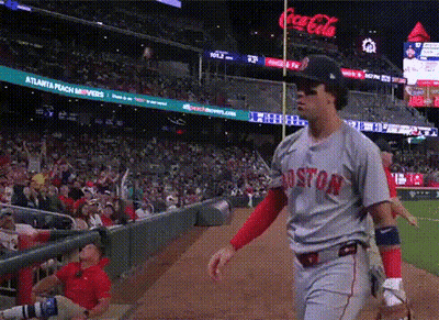A Baseball Player Wearing A Boston Jersey Walks Towards The Dugout GIF
