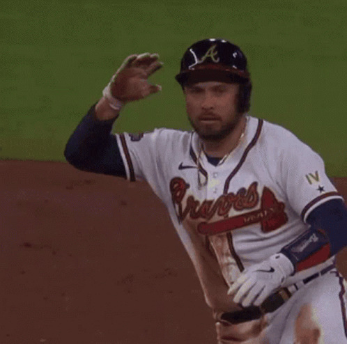 A Baseball Player Wearing A Braves Jersey Is Waving GIF
