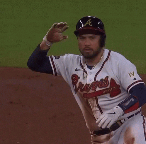 A Baseball Player Wearing A Braves Jersey Stands On The Field GIF