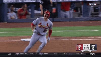A Baseball Player Wearing A Cardinals Jersey Runs Towards Home Plate GIF